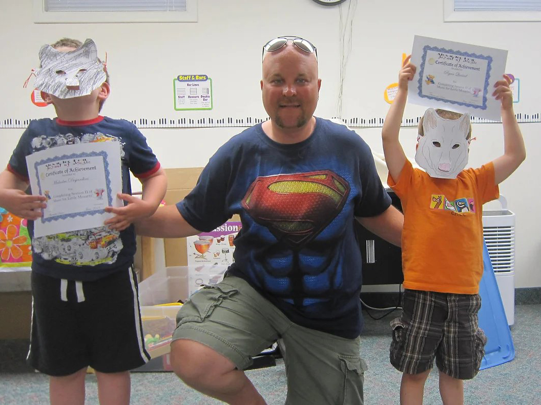 MFLM Alex with Students Image